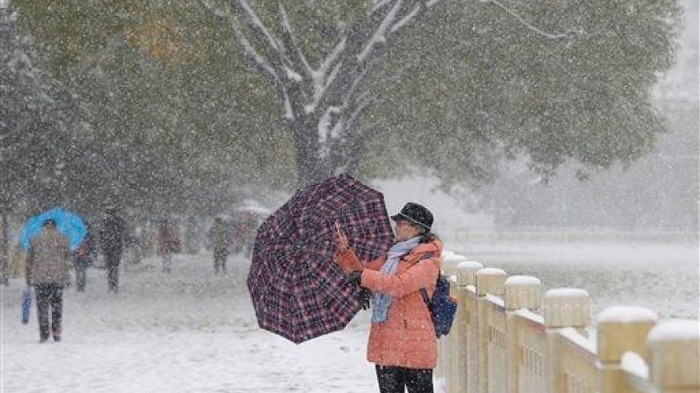 Beijing`s snow is so dirty, it advises use of umbrellas  